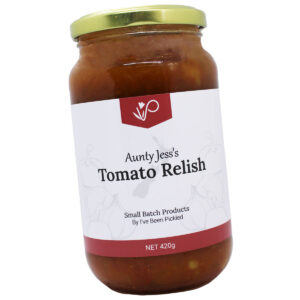 Jar of classic tomato relish with a vibrant red color, showcasing rich tomato goodness and a zesty punch.
