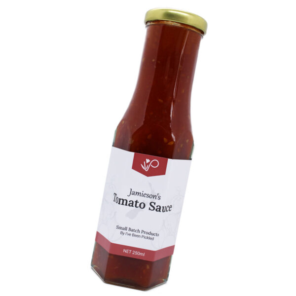 Sweet and tangy tomato sauce in a glass jar with a bold label, perfect for enhancing any meal.