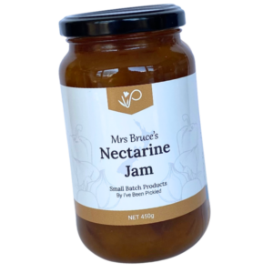 Jar of homemade nectarine jam with a rich golden hue, made from ripe New Zealand nectarines, perfect for toast, desserts, or cheeseboards.